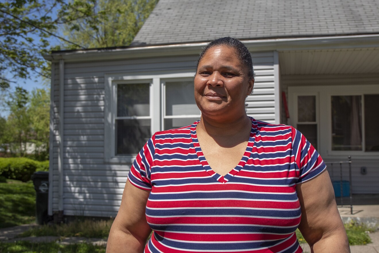 Lisa Lofton stands in front of her Mount Healthy home where she operates her daycare.